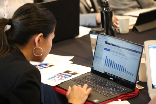 A woman engages with a data dashboard.